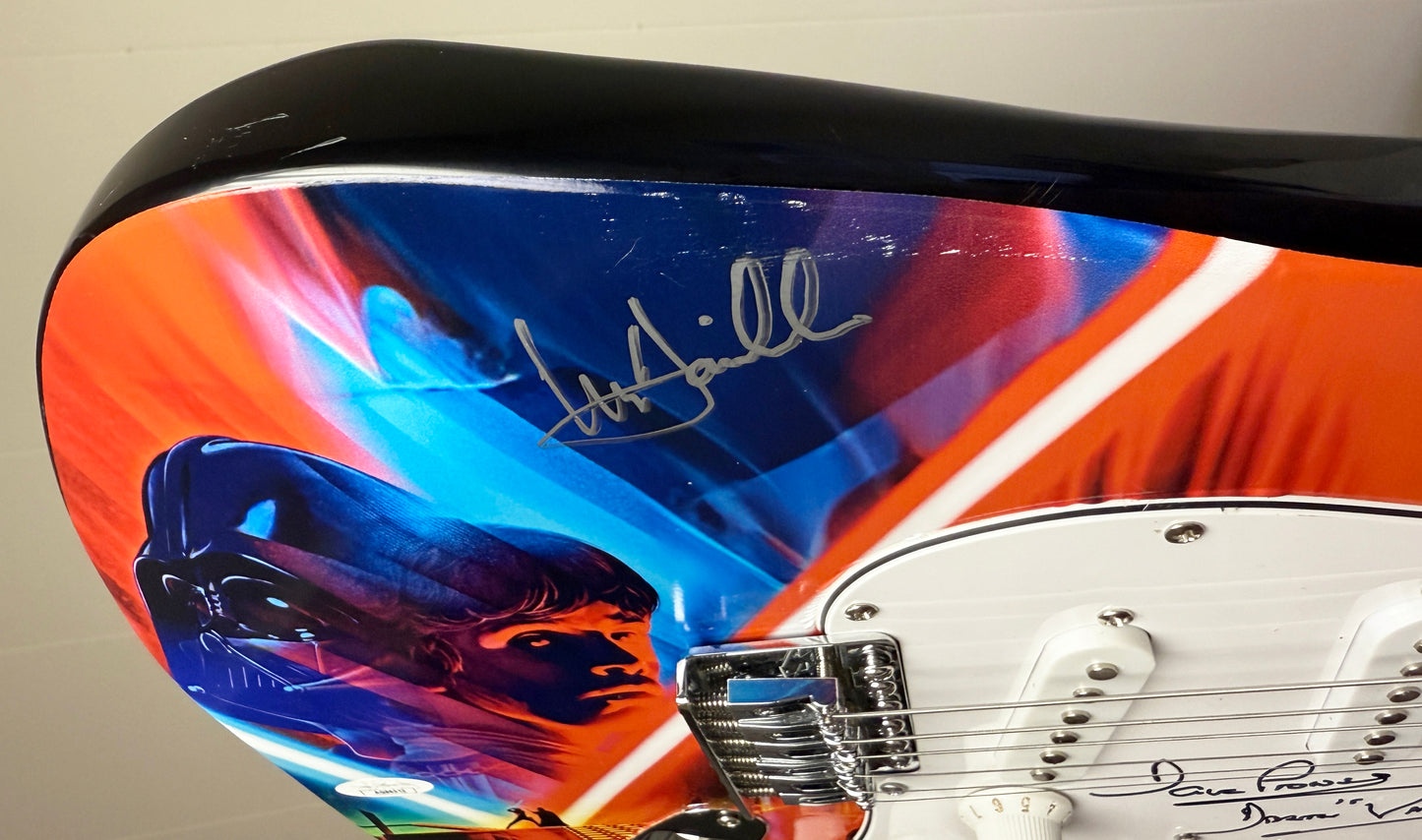 
                  
                    Star Wars: The Empire Strikes Back Lightsaber Duel Electric Guitar (JSA / ACOA) Signed by Dave Prowse as Darth Vader & Mark Hamill as Luke Skywalker
                  
                