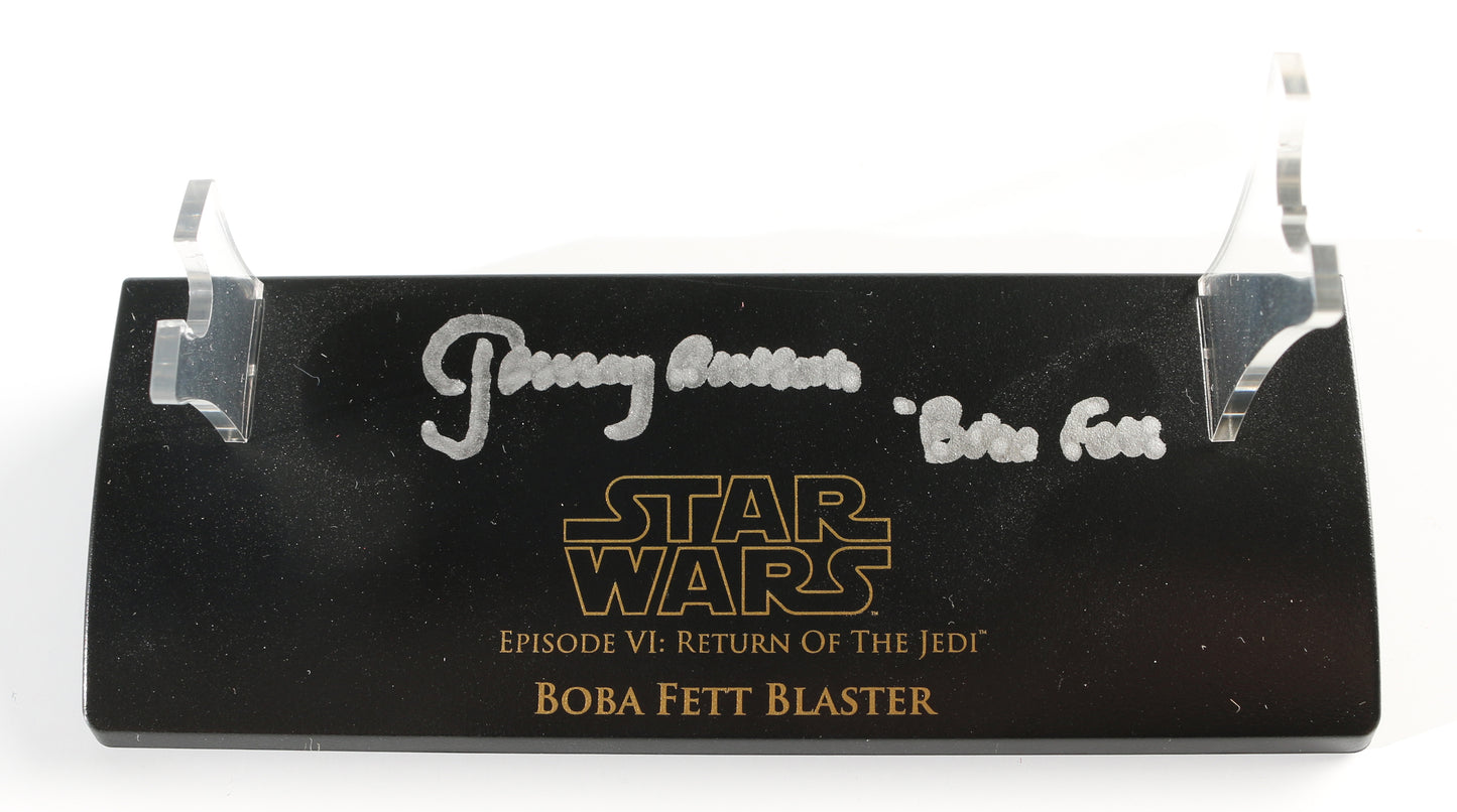 
                  
                    Jeremy Bulloch as Boba Fett in Star Wars: Return of the Jedi Master Replicas Scaled Prop Replica Mini Blaster with Character Name
                  
                