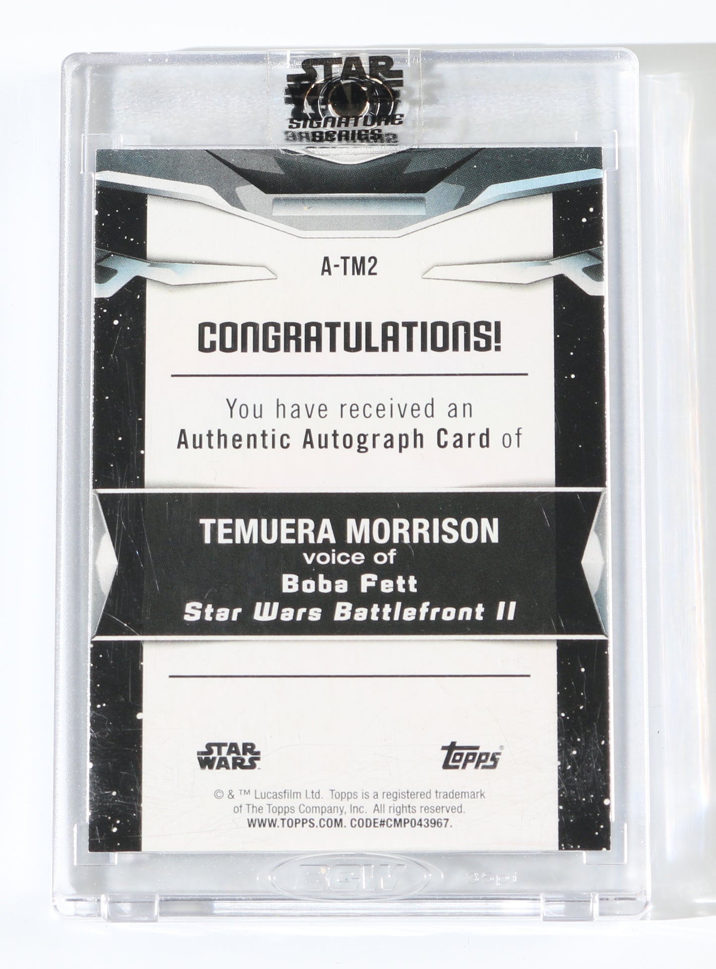 
                  
                    Temuera Morrison as Boba Fett in Star Wars Battlefront II Signed Topps Trading Card #A-TM2 Limited Edition #65/99
                  
                