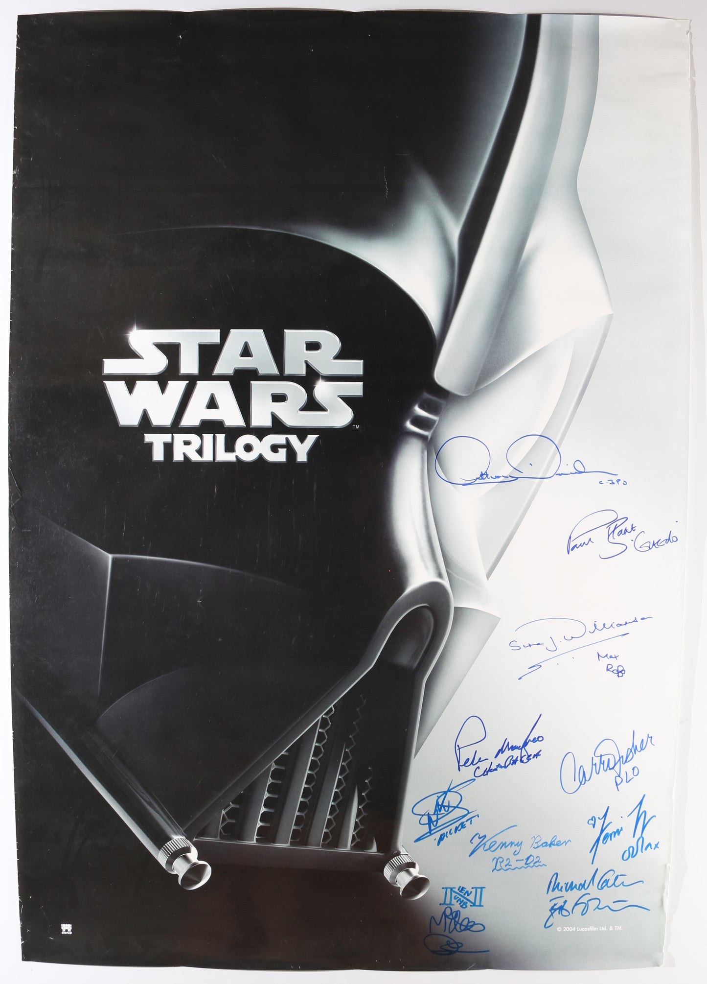 
                  
                    Star Wars Trilogy 27x39 Poster Cast Signed by Carrie Fisher, Anthony Daniels, Paul Blake, Simon Williamson, Peter Mayhew, Warwick Davies, Kenny Baker, Femi Taylor, Michael Carter, & Mike Quinn with Character Names
                  
                