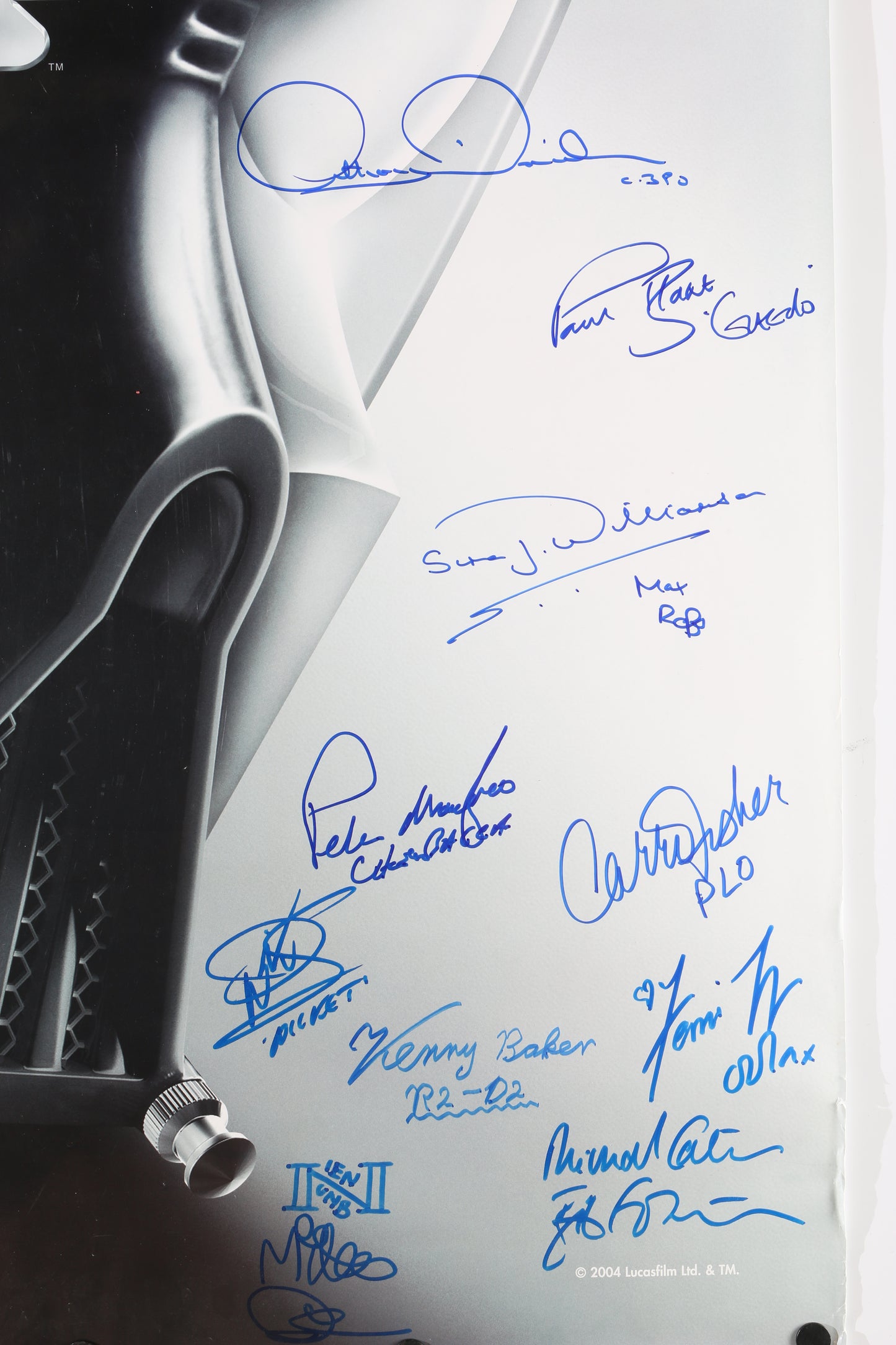 
                  
                    Star Wars Trilogy 27x39 Poster Cast Signed by Carrie Fisher, Anthony Daniels, Paul Blake, Simon Williamson, Peter Mayhew, Warwick Davies, Kenny Baker, Femi Taylor, Michael Carter, & Mike Quinn with Character Names
                  
                