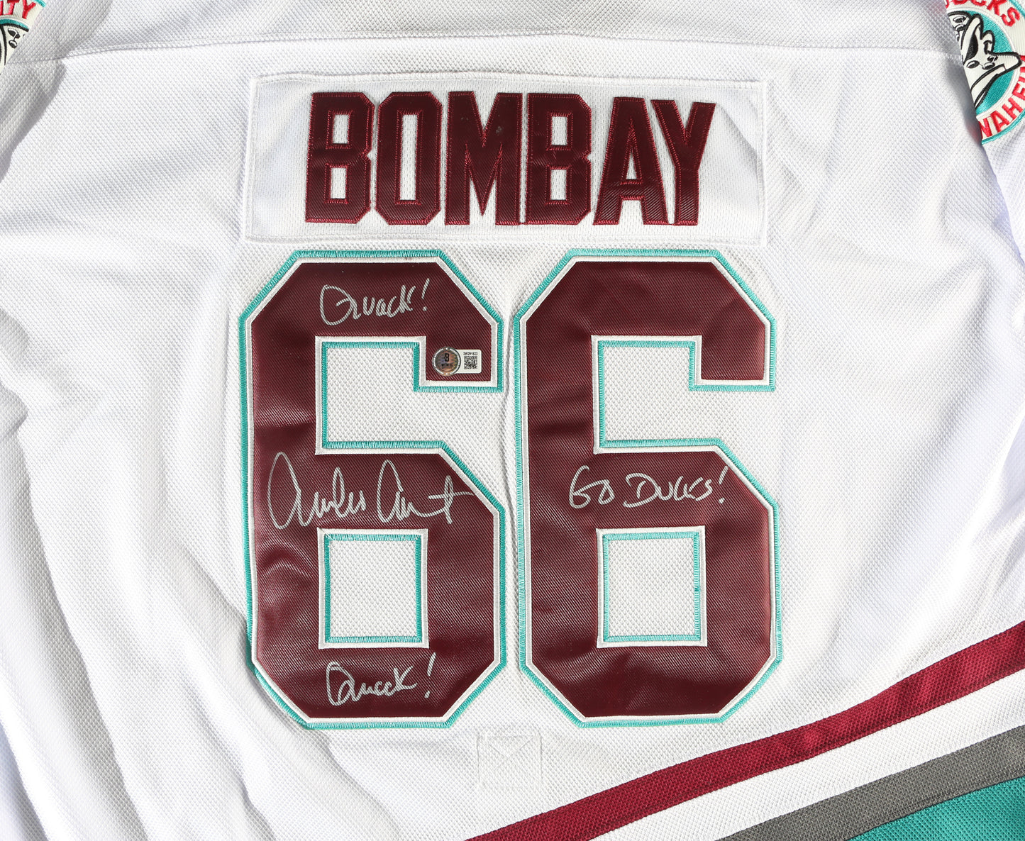 
                  
                    Coach Gordon Bombay from The Mighty Ducks (Beckett) Prop Replica Jersey Signed by Emilio Estevez with Character Name & Quote
                  
                