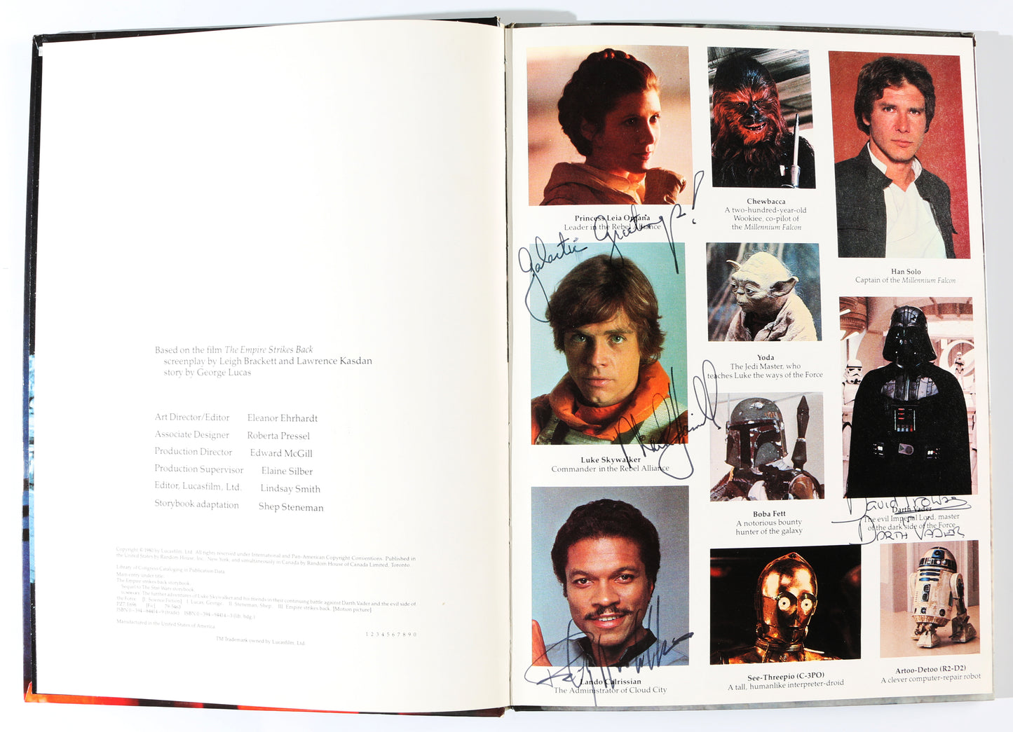 
                  
                    Mark Hamill as Luke Skywalker, Dave Prowse as Darth Vader, & Billy Dee Williams as Lando Calrissian in Star Wars: The Empire Strikes Back Vintage Signed Storybook with Character Name & Quote
                  
                