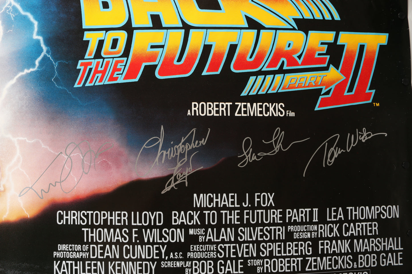 
                  
                    Back to the Future Part II (SWAU) 46x60 Poster Cast Signed by Michael J. Fox, Christopher Lloyd, Tom Wilson, & Lea Thompson
                  
                