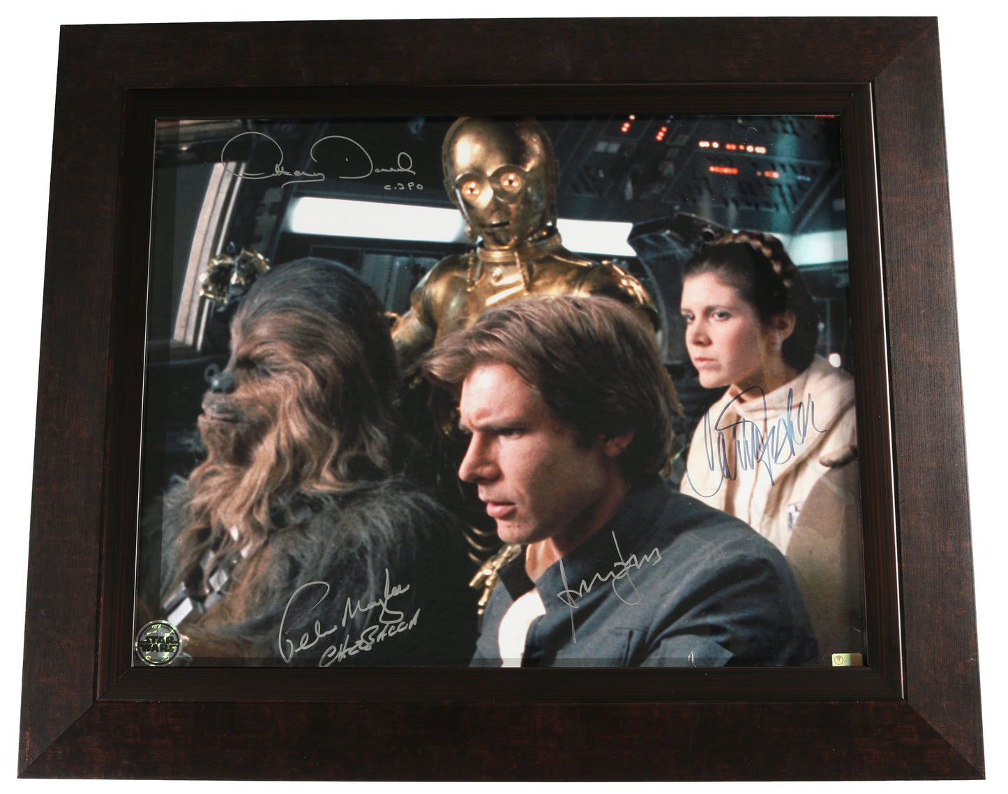 
                  
                    Harrison Ford as Han Solo, Carrie Fisher as Princess Leia, Peter Mayhew as Chewbacca, & Anthony Daniels as C-3PO in Star Wars: The Empire Strikes Back (Official Pix) Framed Signed 16x20 Photo with Character Names
                  
                