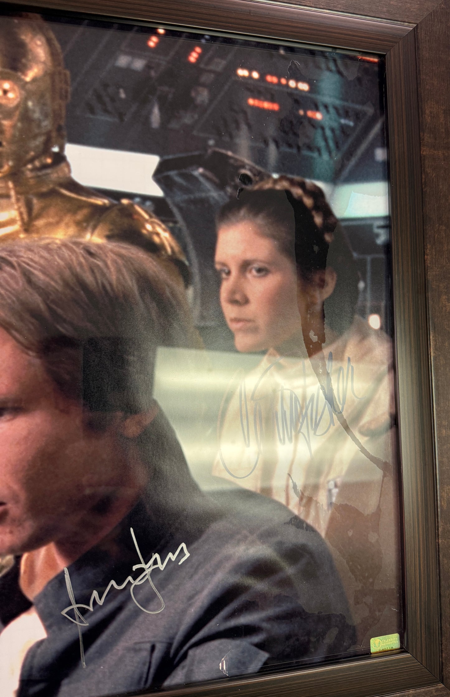 
                  
                    Harrison Ford as Han Solo, Carrie Fisher as Princess Leia, Peter Mayhew as Chewbacca, & Anthony Daniels as C-3PO in Star Wars: The Empire Strikes Back (Official Pix) Framed Signed 16x20 Photo with Character Names
                  
                