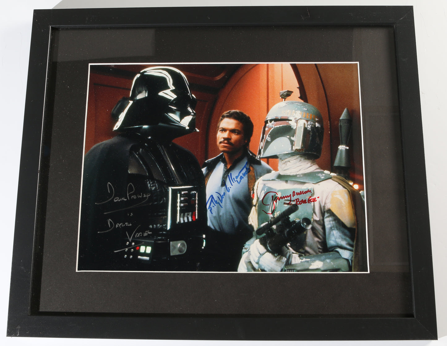 
                  
                    Dave Prowse as Darth Vader, Billy Dee Williams as Lando, & Jeremy Bulloch as Boba Fett in Star Wars: The Empire Strikes Back Framed Signed 11x14 Photo
                  
                