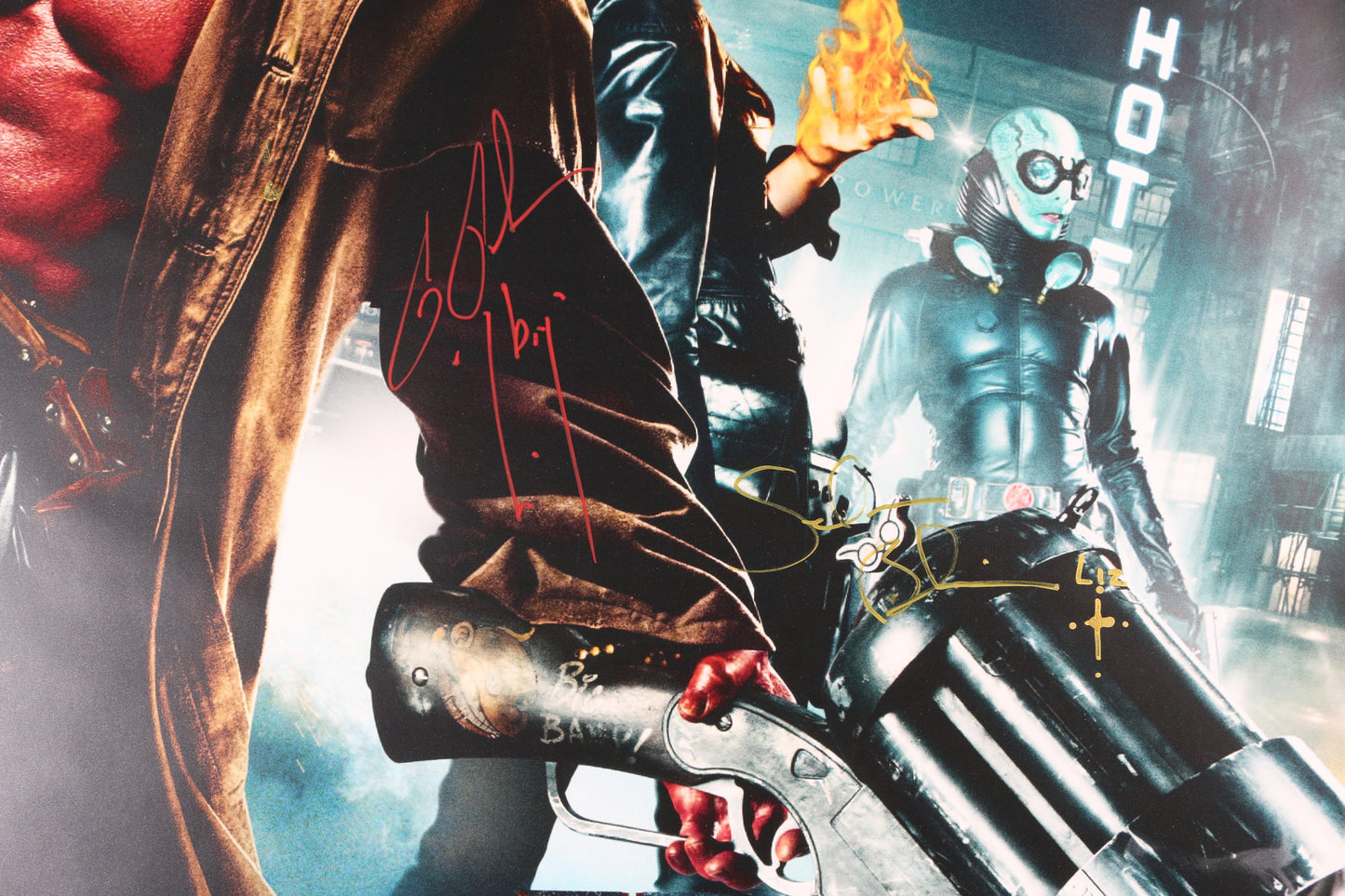 
                  
                    Ron Perlman as Hellboy, Selma Blair as Liz Sherman, & Creator: Mike Mignola in Guillermo del Toro's Hellboy II: The Golden Army Signed 27x40 Poster with Character Names
                  
                