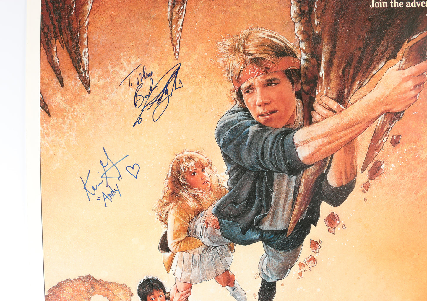 
                  
                    The Goonies 27x40 Poster Cast Signed by Sean Astin, Josh Brolin, Martha Plimpton, Kerri Green, Ted Grossman, & Director: Richard Donner
                  
                