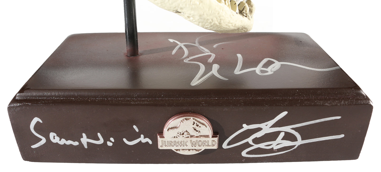 
                  
                    Sam Neill as Alan Grant, Laura Dern as Ellie Sattler, & Jeff Goldblum as Ian Malcolm in Jurassic Park Signed T-Rex Skull Prop Replica Paper Weight
                  
                