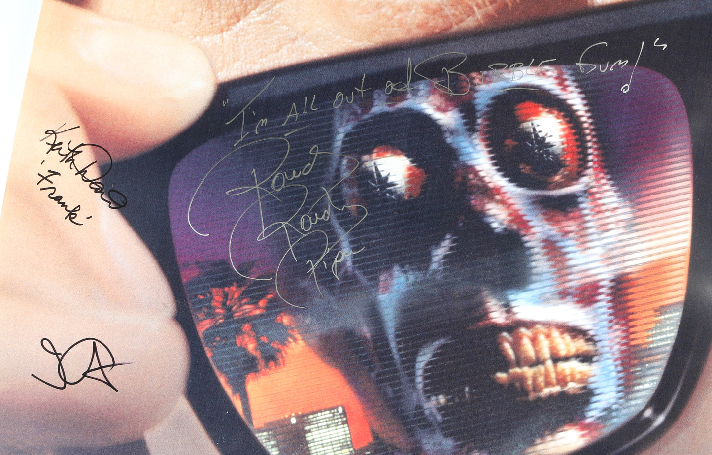 
                  
                    They Live 27x40 Poster Cast Signed by Roddy Piper, Keith David, & Director: John Carpenter with Character Name & Quote
                  
                