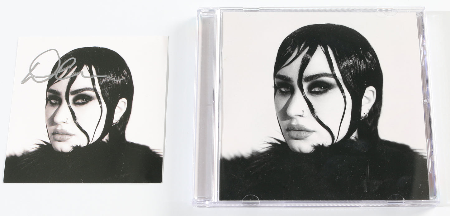 
                  
                    Revamped CD Album Insert Signed by Demi Lovato
                  
                