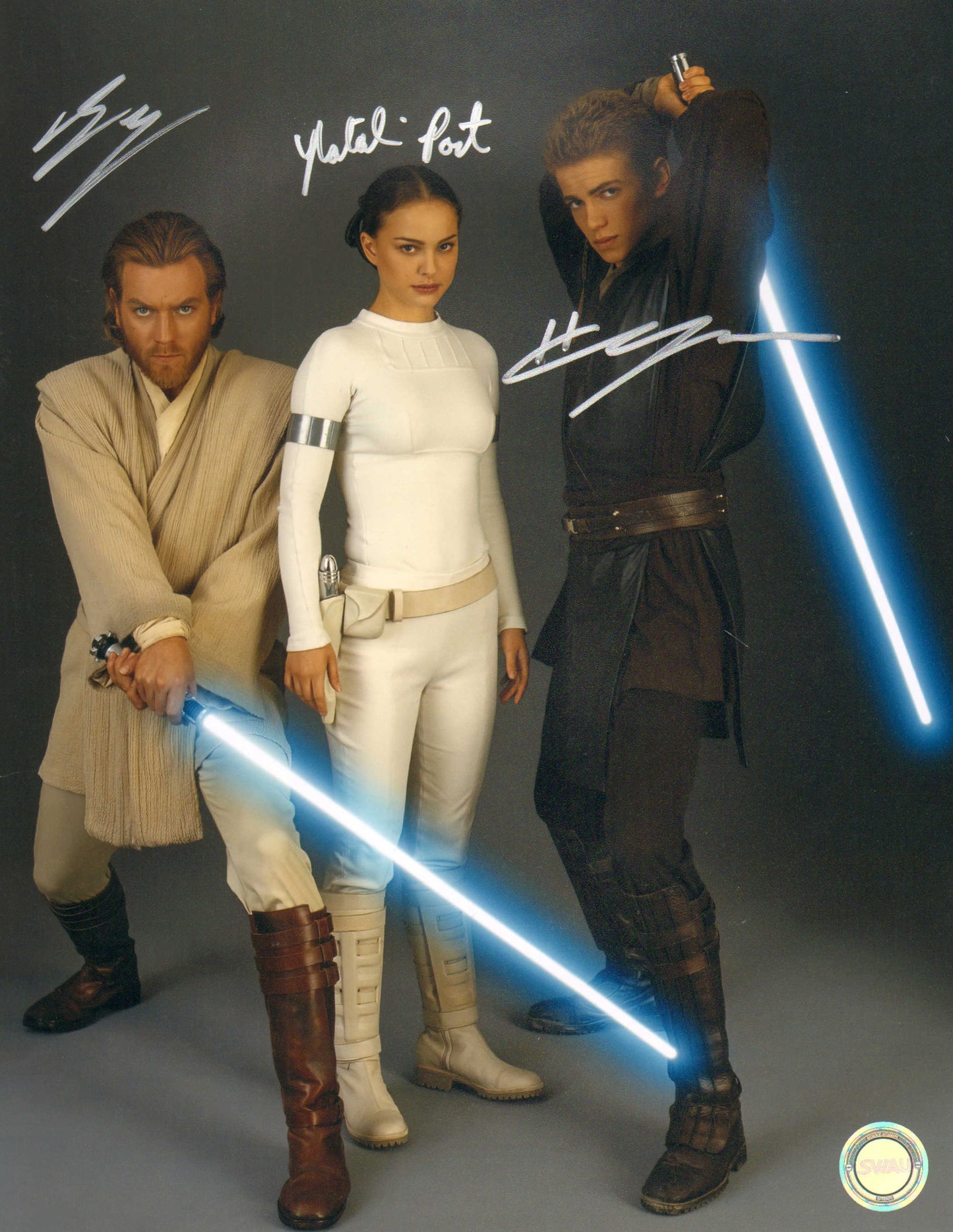 
                  
                    Ewan McGregor as Obi-Wan Kenobi, Natalie Portman as Padme Amidala, & Hayden Christensen as Anakin Skywalker in Star Wars Episode II: Attack of the Clones (SWAU) Signed 11x14 Photo
                  
                